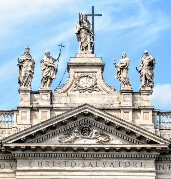 A statue of Christ the Redeemer crowns the facade of the church of San Giovanni in Laterano (St John Lateran), Rome