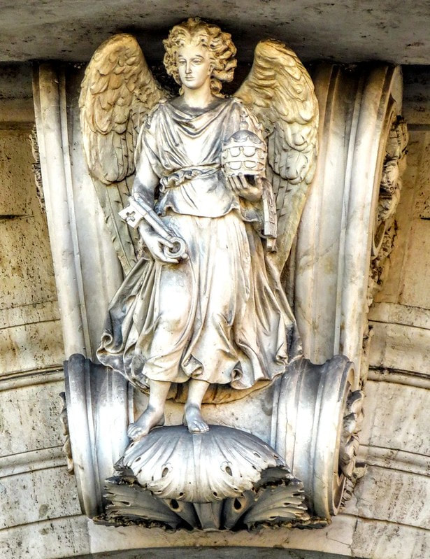 Angel holding papal tiara and keys of St Peter, outer arch of Porta Pia, Rome