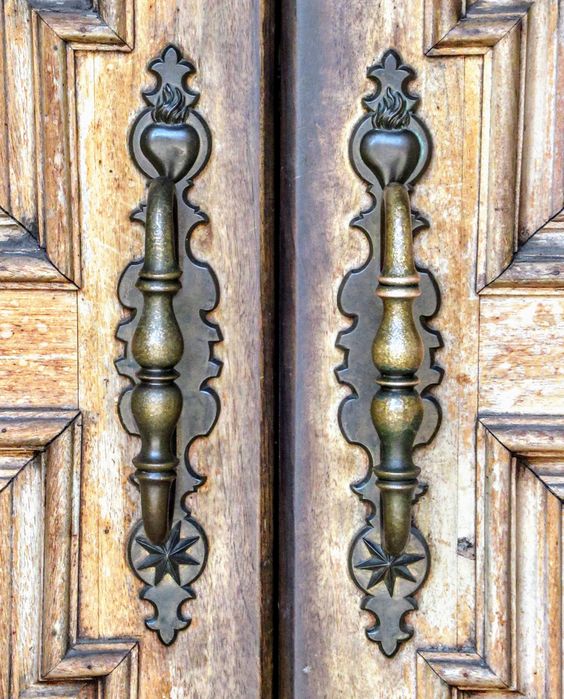 Door handles decorated with the cor flammigerum (flaming heart), the emblem of San Filippo Neri, Chiesa Nuova, Rome