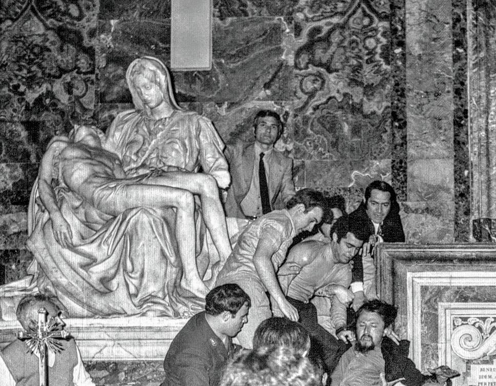 May 21st 1972, Laszlo Toth is dragged away after attacking Michelangelo's Pieta in St Peter's Basilica
