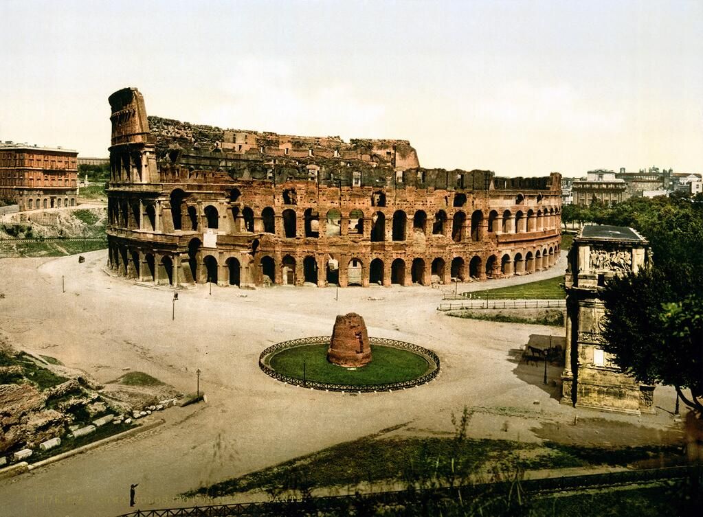 Old photograph of the Colosseum showing the remains of the Meta Sudans, an ancient Roman fountain