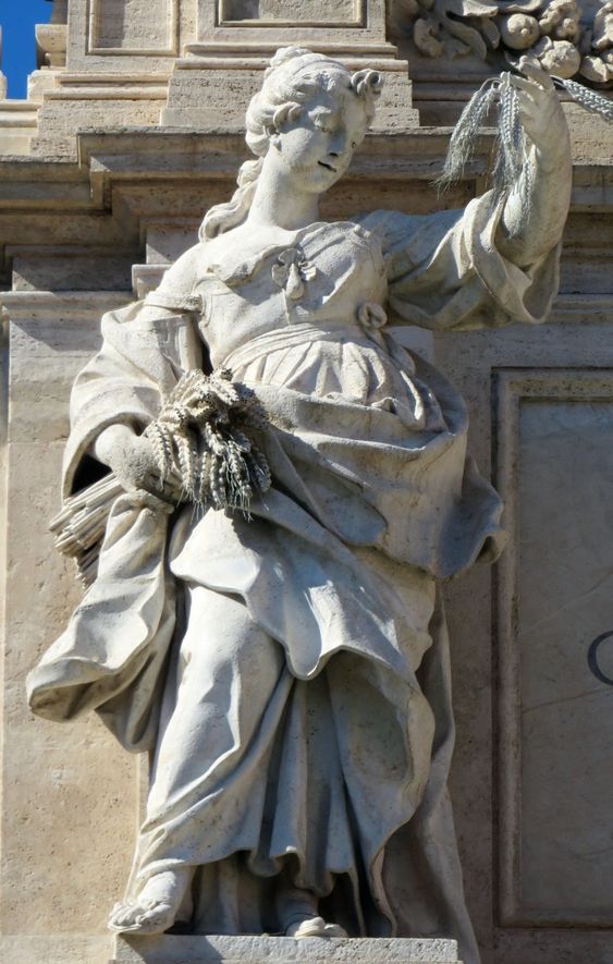 One of the four allegorical statues that crown the Trevi Fountain in Rome