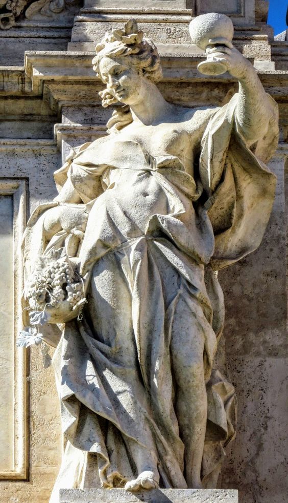 One of the four allegorical statues that crown the Trevi Fountain in Rome