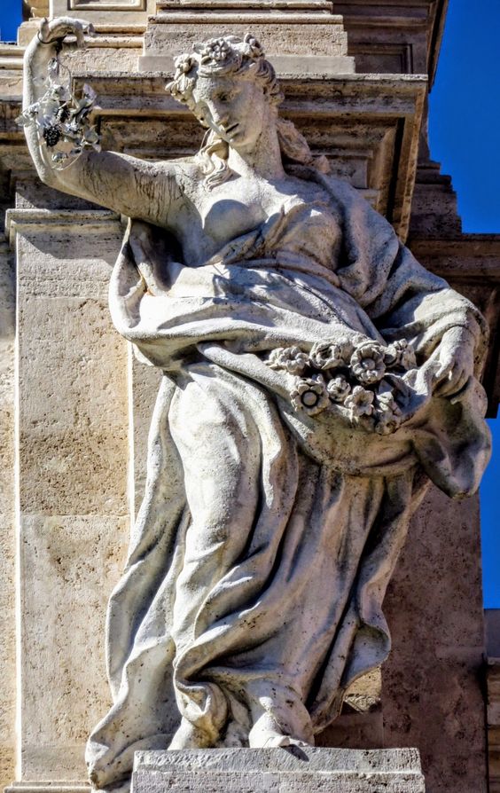 One of the four female statues that crown the Trevi Fountain in Rome