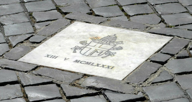 Plaque marking spot where Pope John Paul ll was shot on May 13, 1981, St Peter's Square, Rome