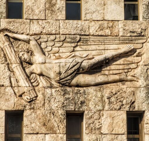 A winged female figure holds the fasces, Piazza Augusto Imperatore, Rome
