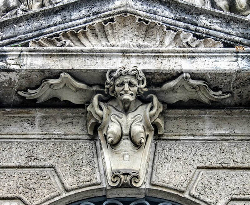 A winged harpy. A detail of the facade of Palazzo della Consulta, Rome