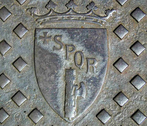 Manhole cover sporting the letters SPQR and the Fasces, Rome