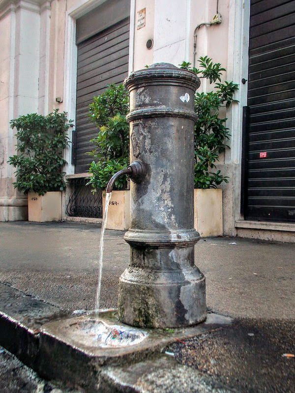 A traditional street fountain in Rome