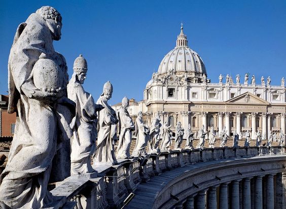 Statues of saints and martyrs atop the south colonnade of St Peter's Square, Rome
