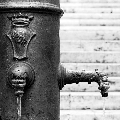 Street fountain bearing the letters SPQR, Rome